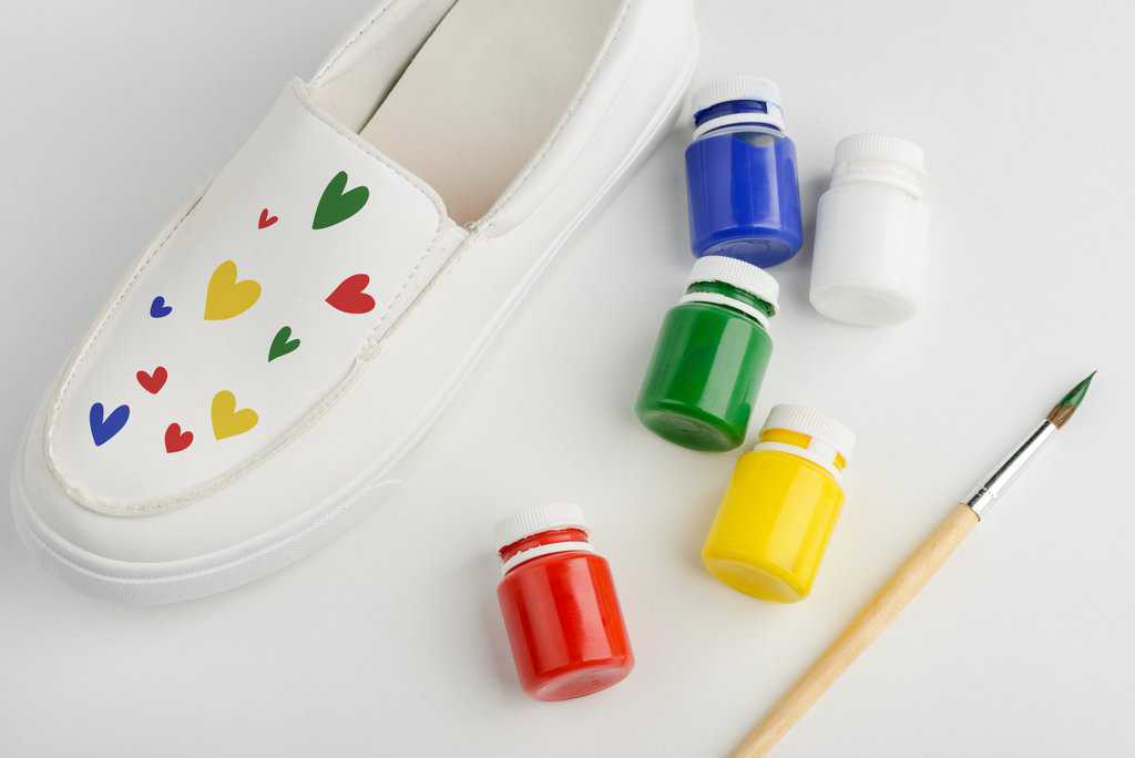 White shoe with colorful painted hearts