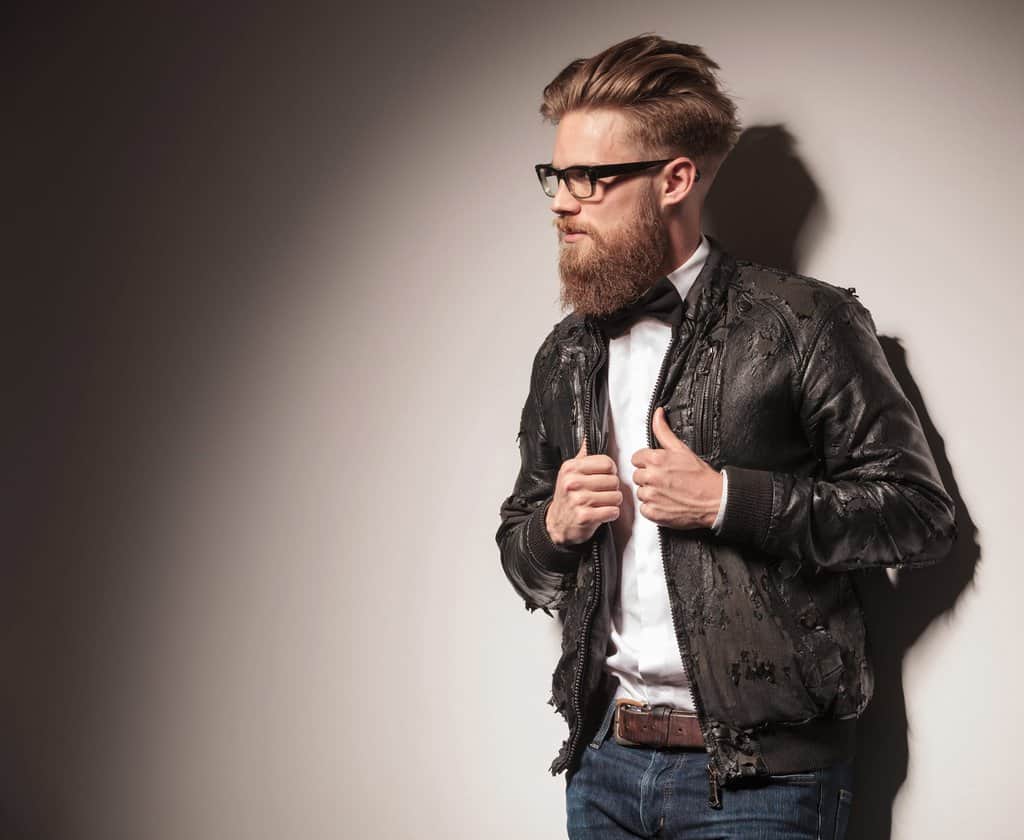 young business man wearing peeling black leather jacket