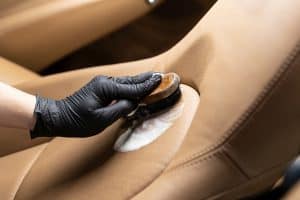 remove gum from leather car seat with brush